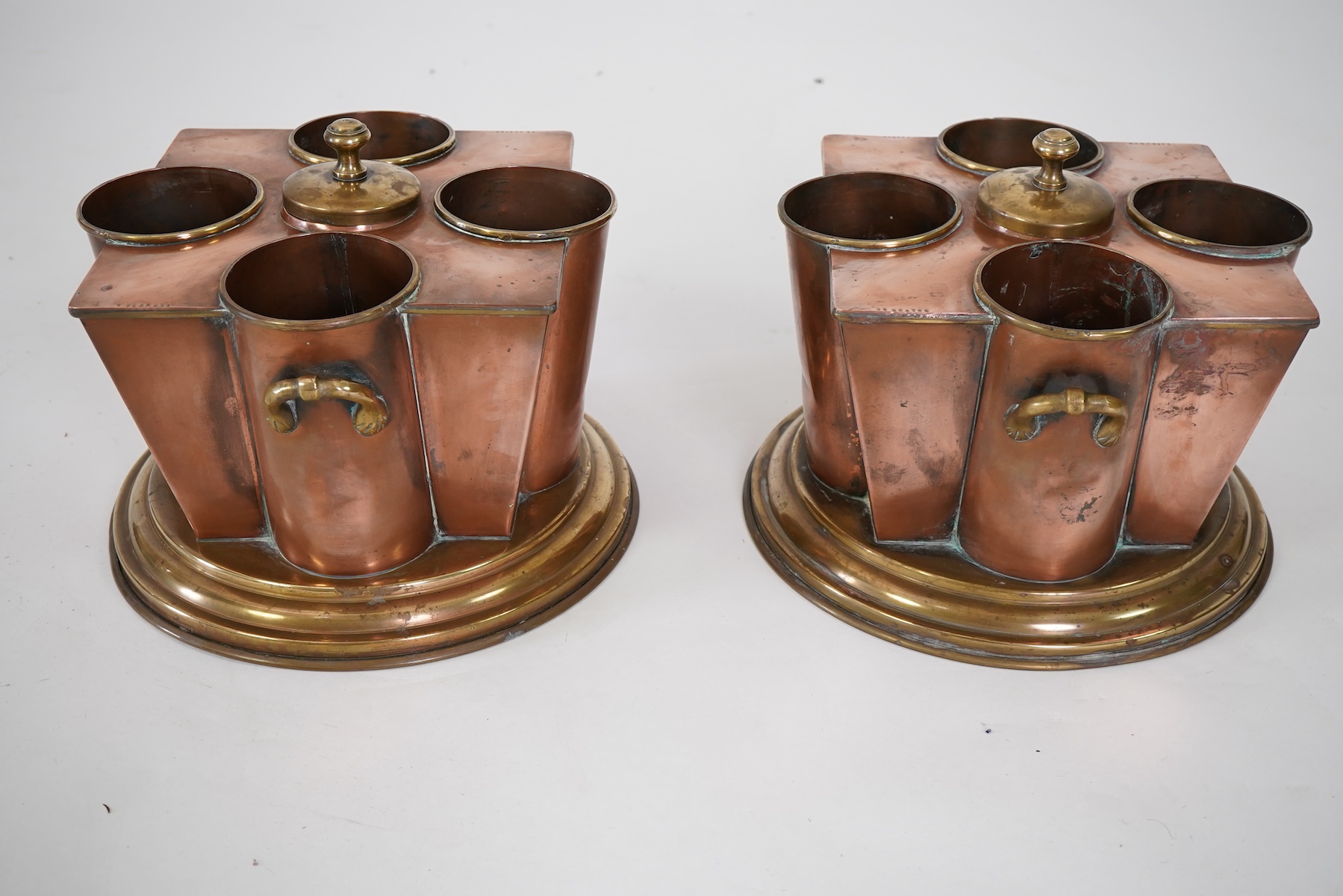 A pair of Art Deco copper and brass champagne/wine coolers, from the passenger ship SS Boston (1924-1942)
